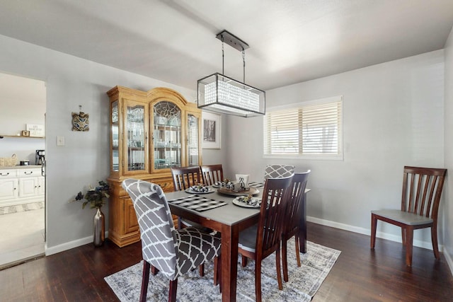3501 Westerfeld Dr NE, Albuquerque, NM 87111 - dining area featuring baseboards and dark wood finished floors