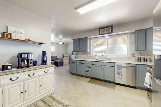 3501 Westerfeld Dr NE, Albuquerque, NM 87111 - kitchen with ceiling fan, gray cabinets, appliances with stainless steel finishes, a sink, and backsplash
