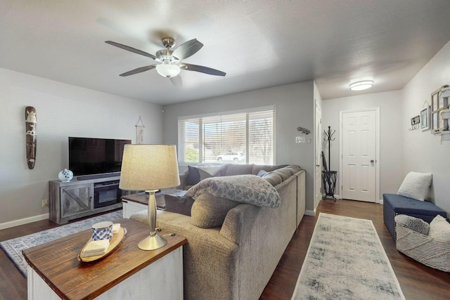 3501 Westerfeld Dr NE, Albuquerque, NM 87111 - living room with dark wood-style flooring, baseboards, and a ceiling fan