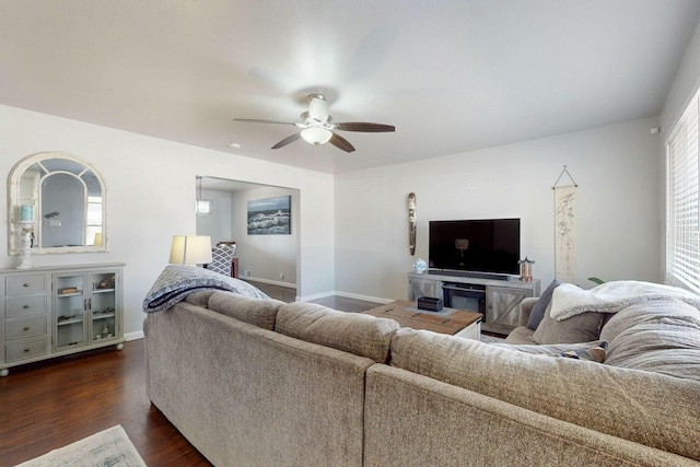 3501 Westerfeld Dr NE, Albuquerque, NM 87111 - living room featuring dark wood finished floors, baseboards, and ceiling fan