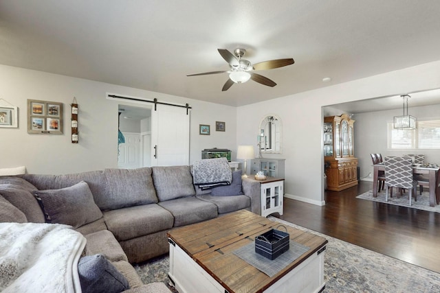 3501 Westerfeld Dr NE, Albuquerque, NM 87111 - living area featuring ceiling fan, baseboards, dark wood finished floors, and a barn door