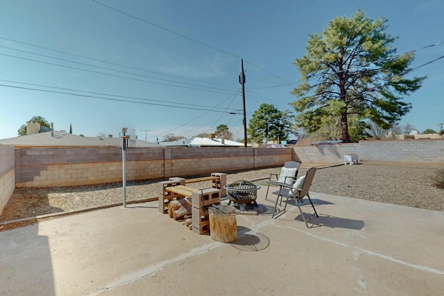 3501 Westerfeld Dr NE, Albuquerque, NM 87111 - view of patio featuring a fenced backyard and a fire pit