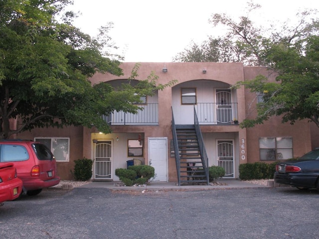 3600 Tulane Dr NE, Albuquerque, NM 87107 - view of front of home with stairway and stucco siding