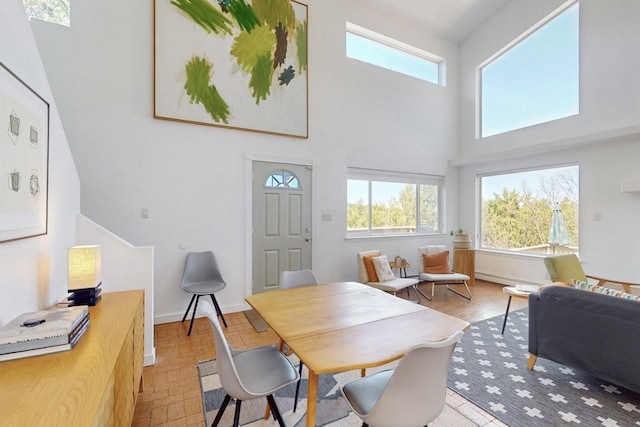 2 Cedar Hill Pl, Cedar Crest, NM 87008 - dining room featuring healthy amount of natural light and a high ceiling