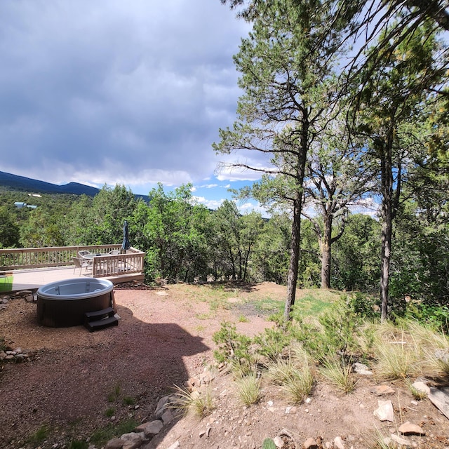2 Cedar Hill Pl, Cedar Crest, NM 87008 - view of yard with a deck and a view of trees