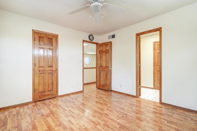8300 R C Gorman Ave NE, Albuquerque, NM 87122 - unfurnished bedroom featuring light wood finished floors and baseboards
