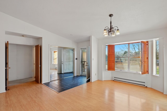 unfurnished dining area with an inviting chandelier, wood finished floors, a baseboard heating unit, lofted ceiling, and a baseboard radiator