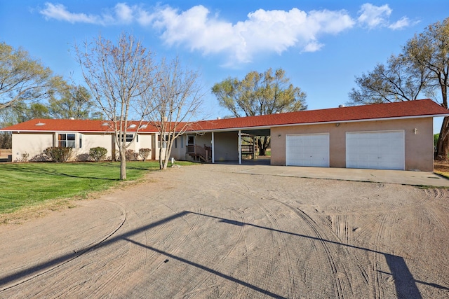 single story home with stucco siding, a front lawn, and dirt driveway