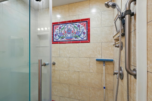 bathroom with a shower stall