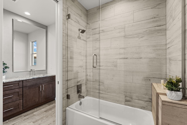 8023 Victoria Dr NW, Albuquerque, NM 87120 - full bath featuring recessed lighting, enclosed tub / shower combo, wood finished floors, and vanity