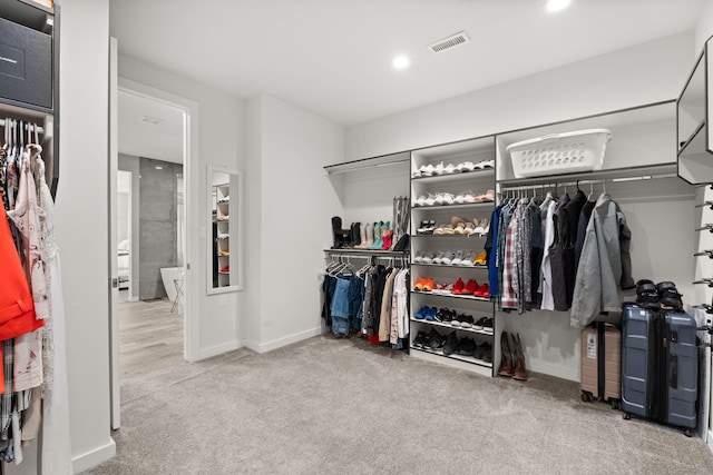 8023 Victoria Dr NW, Albuquerque, NM 87120 - walk in closet featuring carpet and visible vents