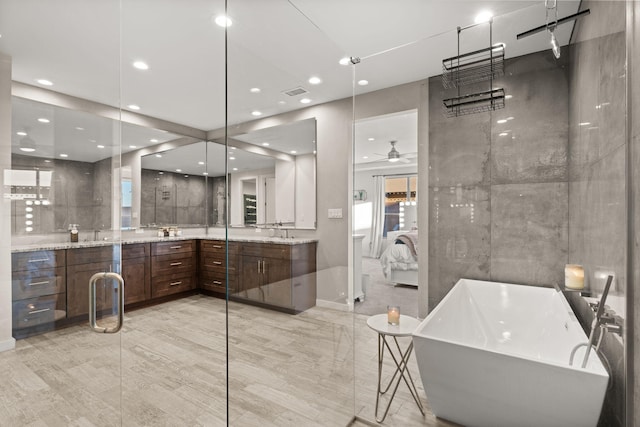 8023 Victoria Dr NW, Albuquerque, NM 87120 - full bathroom featuring ceiling fan, vanity, recessed lighting, a freestanding tub, and ensuite bathroom