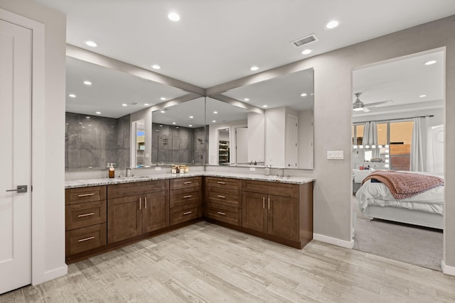 8023 Victoria Dr NW, Albuquerque, NM 87120 - ensuite bathroom featuring double vanity, recessed lighting, wood finished floors, and visible vents