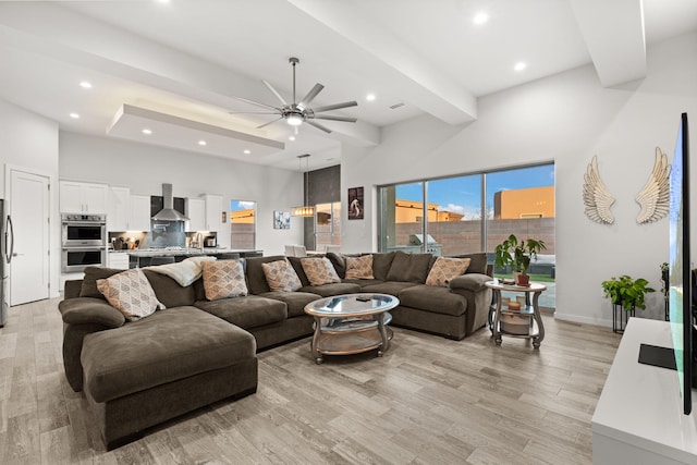 8023 Victoria Dr NW, Albuquerque, NM 87120 - living area with a towering ceiling, light wood-style floors, baseboards, recessed lighting, and a ceiling fan