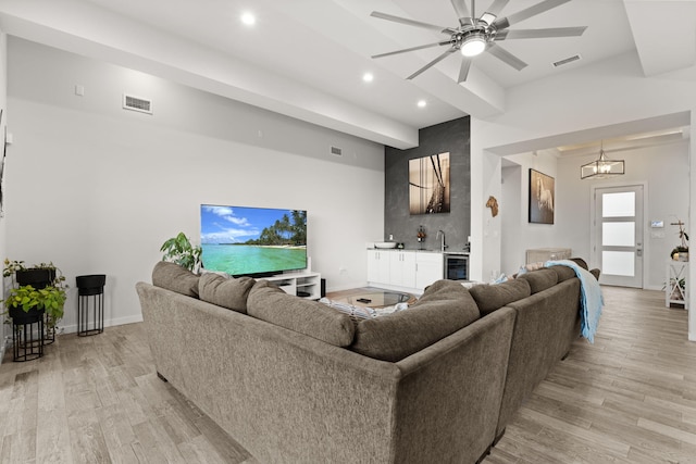 8023 Victoria Dr NW, Albuquerque, NM 87120 - living area with ceiling fan, indoor wet bar, recessed lighting, light wood-type flooring, and visible vents