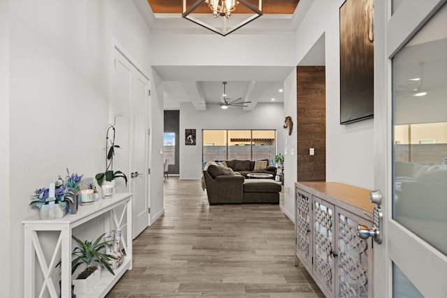8023 Victoria Dr NW, Albuquerque, NM 87120 - hall featuring beamed ceiling, light wood-style floors, baseboards, recessed lighting, and a chandelier