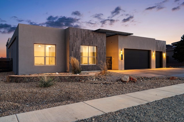 8023 Victoria Dr NW, Albuquerque, NM 87120 - modern home with an attached garage, stucco siding, and driveway