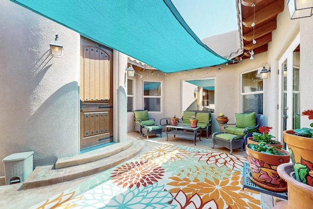 9840 Cameron St NW, Albuquerque, NM 87114 - doorway to property with stucco siding and outdoor lounge area