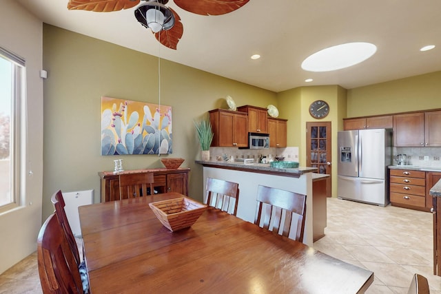 9840 Cameron St NW, Albuquerque, NM 87114 - dining area with light tile patterned flooring, ceiling fan, and recessed lighting