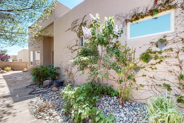 9840 Cameron St NW, Albuquerque, NM 87114 - view of side of property with fence and stucco siding