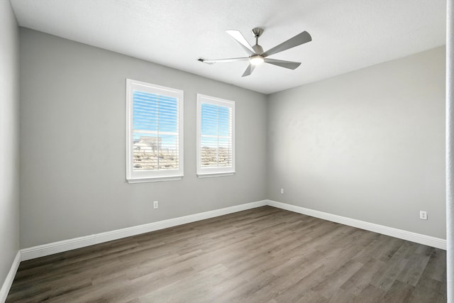 7327 Hearthstone Rd NW, Albuquerque, NM 87114 - unfurnished room featuring wood finished floors, ceiling fan, and baseboards