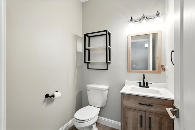 7327 Hearthstone Rd NW, Albuquerque, NM 87114 - half bath with toilet, vanity, and baseboards