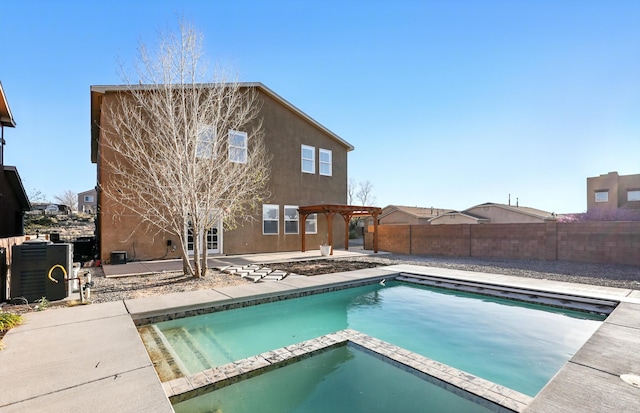 7327 Hearthstone Rd NW, Albuquerque, NM 87114 - view of pool with a pergola, a patio, a fenced backyard, central AC, and a pool with connected hot tub