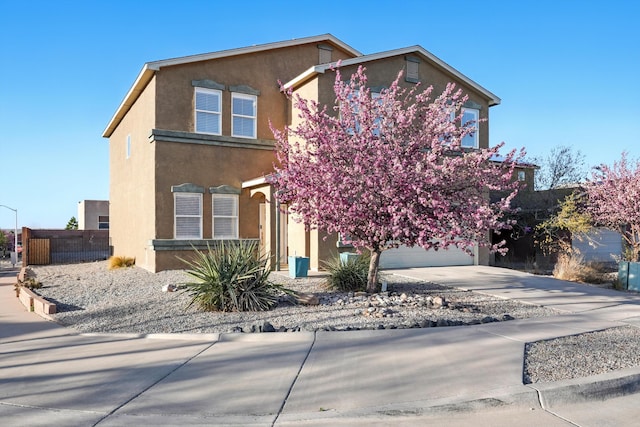 7327 Hearthstone Rd NW, Albuquerque, NM 87114 - view of front of home featuring stucco siding, driveway, and an attached garage