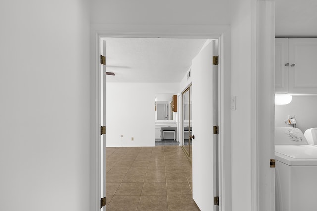 317 Baldwin Ave, Rio Communities, NM 87002 - corridor featuring washing machine and dryer, tile patterned floors, and visible vents