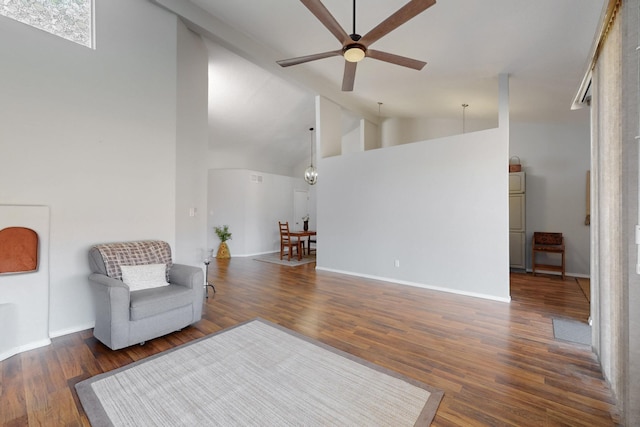 sitting room with baseboards, a ceiling fan, and wood finished floors