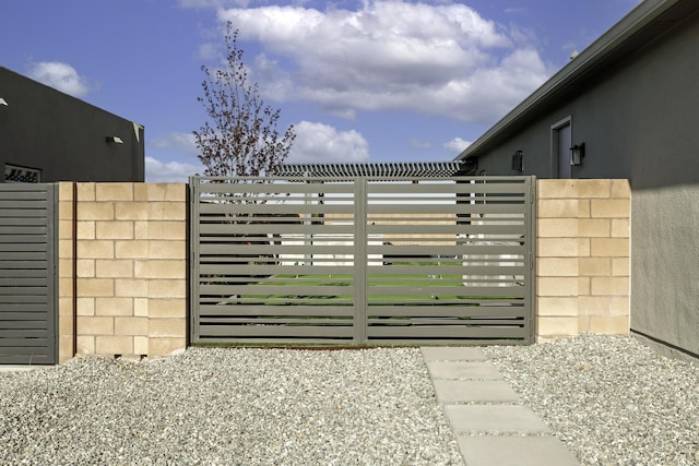 view of gate featuring fence