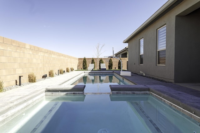 view of pool with a patio area, a fenced backyard, and a fenced in pool