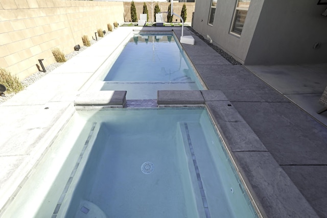view of pool with a fenced backyard and a fenced in pool