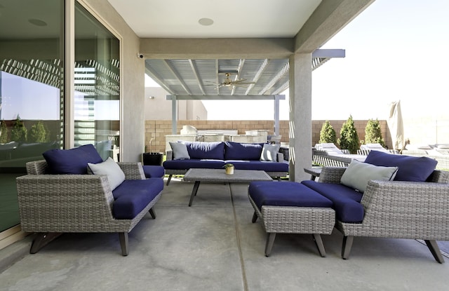 view of patio / terrace featuring outdoor lounge area and fence