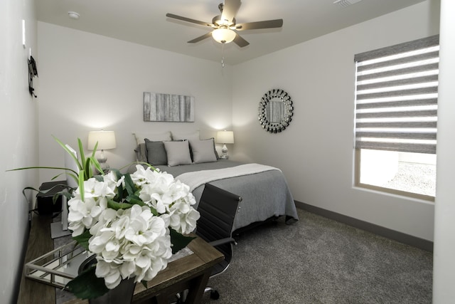 carpeted bedroom with visible vents, baseboards, and ceiling fan