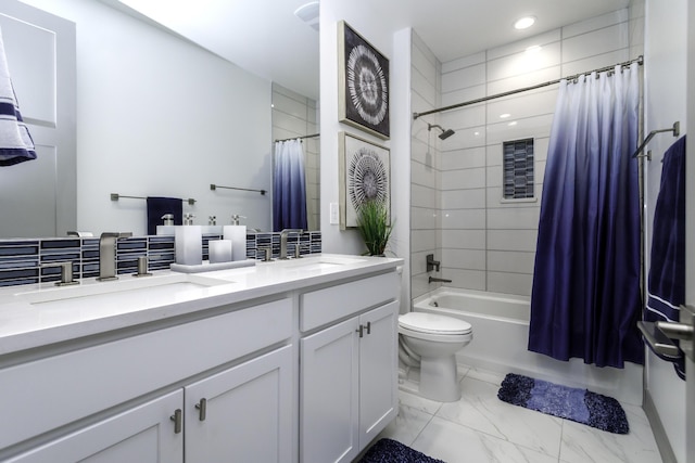 bathroom with double vanity, shower / bath combination with curtain, marble finish floor, and a sink
