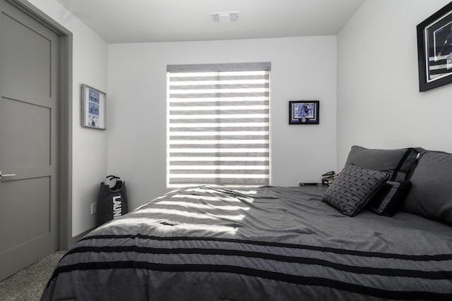 carpeted bedroom with visible vents
