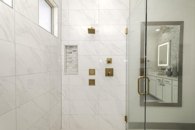 full bath with vanity and a stall shower