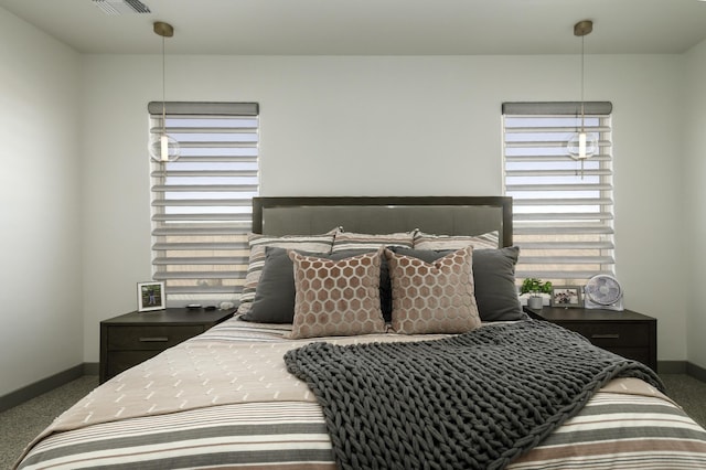 bedroom featuring carpet floors, baseboards, and visible vents