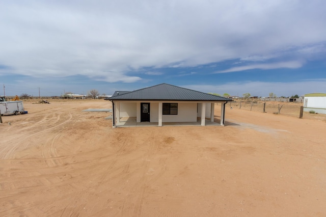 back of property with metal roof