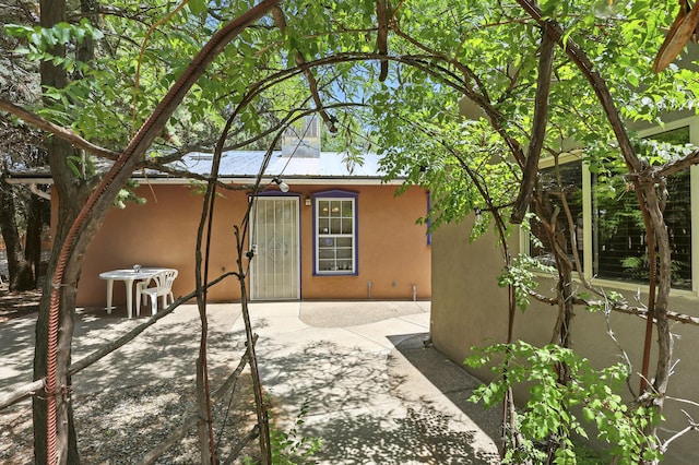 135B Sichler Rd SW, Los Lunas, NM 87031 - rear view of property with stucco siding and a patio area