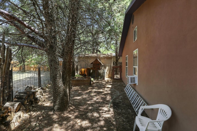 135B Sichler Rd SW, Los Lunas, NM 87031 - view of property exterior with stucco siding and cooling unit