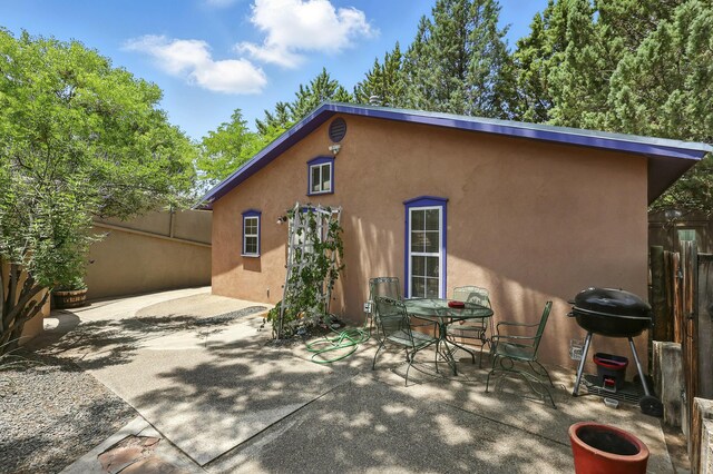 135B Sichler Rd SW, Los Lunas, NM 87031 - rear view of house featuring stucco siding and a patio