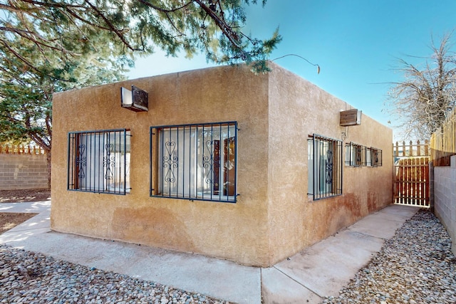 12522 Singing Arrow Ave SE, Albuquerque, NM 87123 - view of home's exterior with stucco siding and fence