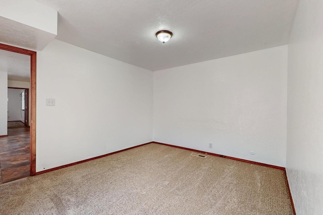 12522 Singing Arrow Ave SE, Albuquerque, NM 87123 - carpeted spare room featuring visible vents and baseboards