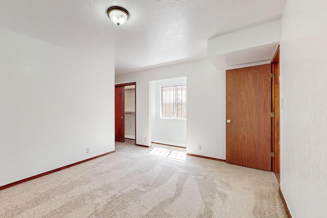 12522 Singing Arrow Ave SE, Albuquerque, NM 87123 - carpeted empty room featuring baseboards and a textured ceiling