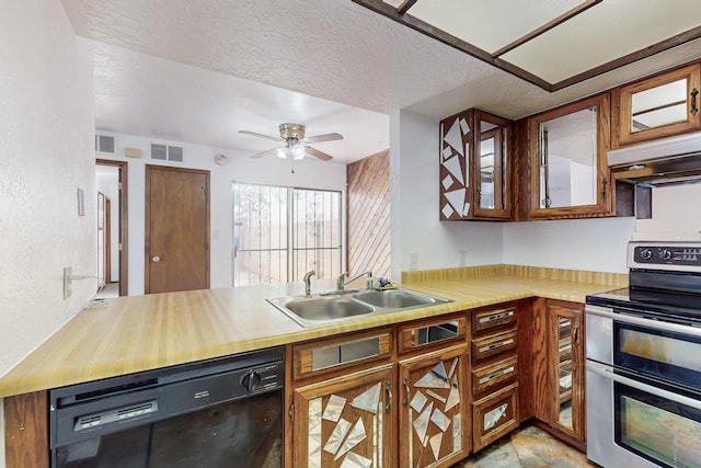 12522 Singing Arrow Ave SE, Albuquerque, NM 87123 - kitchen featuring visible vents, black dishwasher, a sink, under cabinet range hood, and range with two ovens
