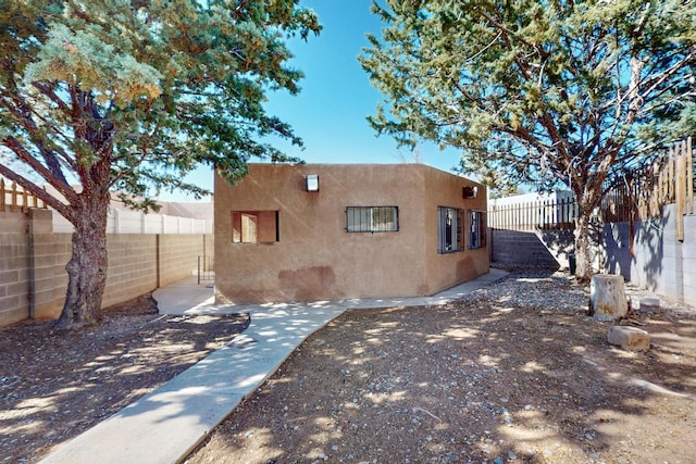 12522 Singing Arrow Ave SE, Albuquerque, NM 87123 - exterior space featuring a fenced backyard and stucco siding