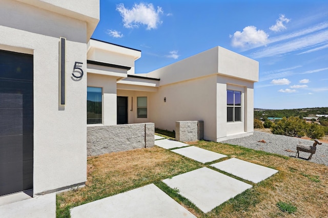exterior space with stucco siding