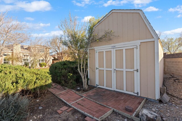 view of shed with fence